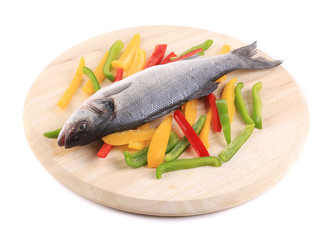 Raw seabass with pepper slices.