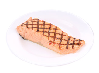 Grilled salmon on the plate.