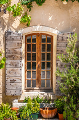 Fototapeta na wymiar Detail of old vintage wooden window with wild roses