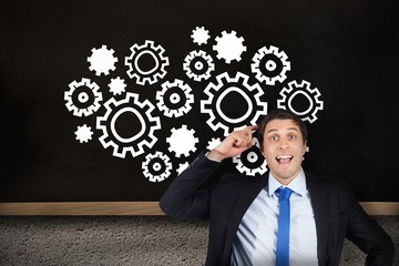 Composite image of thinking businessman scratching head