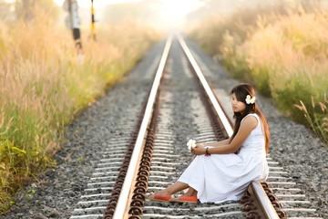 Beautiful young Thai woman meditating