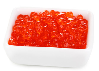 Red caviar in white bowl isolated on white