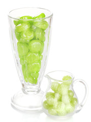 Color candies in glasses isolated on white