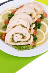 Delicious chicken roll on plate on table close-up
