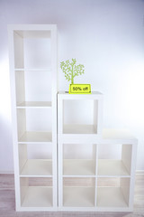New white shelves with price on light background