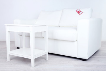New white furniture with price on light background
