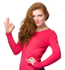 Woman is showing OK sign