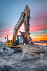 excavator on sunset landscape