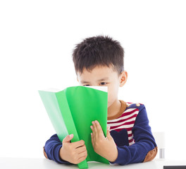 Asian kid reading a book