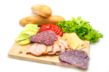 Sandwich ingredients on a wooden board against white background