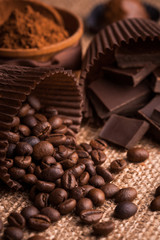 chocolate, coffee beans and cocoa on the burlap