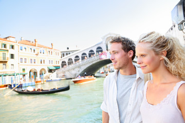 Fototapeta na wymiar Venice couple by Rialto Bridge on Grand Canal