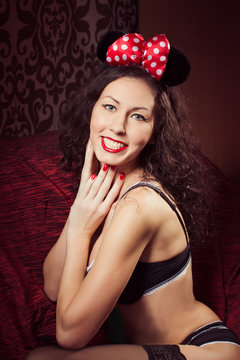 Brunette Pin Up Model Posing Dressed In Underwear And Bow Of  Minnie Mouse