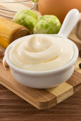 mayonnaise sauce in bowl on white