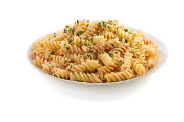 pasta fusilli in plate on white