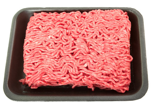 A tray of fresh lean ground beef from supermarket isolated on wh