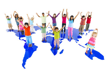 Fototapeta na wymiar Group of children hands up and standing on the world map
