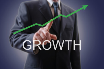Fototapeta premium Businessman indicating the growth