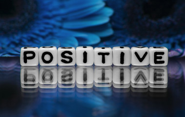 Positive text with blue flowers