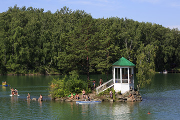 Island with a gazebo on a lake Aya. Altai. Russia.