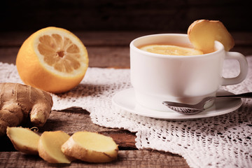 Ginger tea with lemon in a white cup