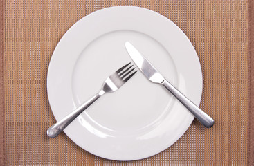 White plate on a bamboo mat