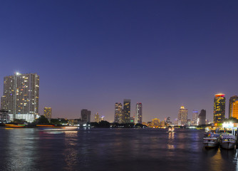 Fototapeta na wymiar river Mae Nam Chao Phraya in Bangkok with panorama and skyscraper twilight
