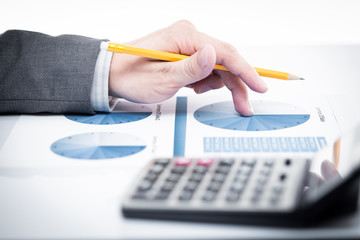 Businessman's hand showing financial report