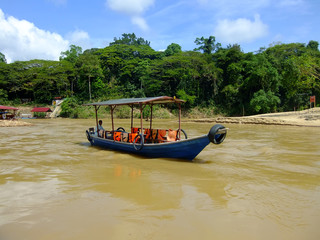 Fototapeta na wymiar Tourist boat on Tembeling river, Taman Negara National Park, Mal