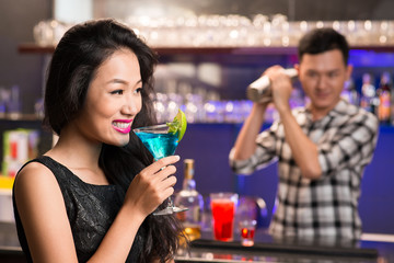 Vietnamese woman with a drink