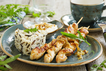 Barbecue beef skewers with sauce.