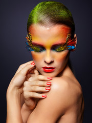 Woman with fashion feather eyelashes make-up