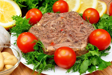 jellied meat with fresh herbs and cherry tomatoes