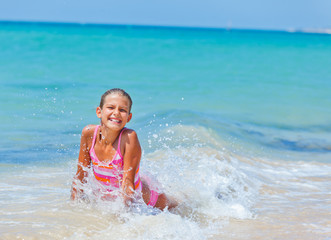 Cute girl with surfboard