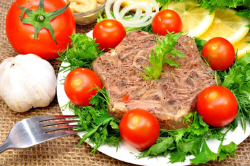 jellied meat with fresh herbs and cherry tomatoes