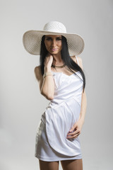 Pretty Caucasian woman in white dress