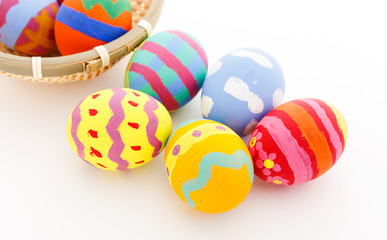 Fototapeta na wymiar Colourful easter egg in basket