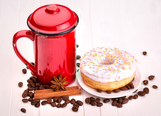Tasty donut with a cup of coffee