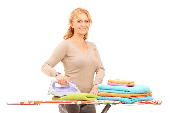 Mature Woman Ironing Clothes