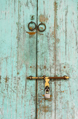 an old wood door with metal handle