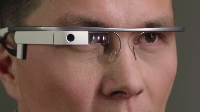 Close-up of man using optical computer device. Suitable for tech, future concepts, data processing, research, modern computing visuals
