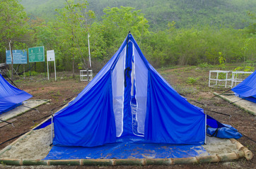 camping tent on a natural field in the morning light