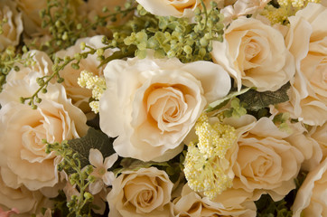 wedding bouquet with rose bush, Ranunculus asiaticus as a background