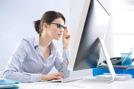 Office worker staring at computer screen