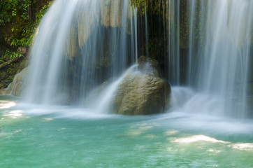 Fototapeta na wymiar Blue stream waterfall in Kanjanaburi Thailand