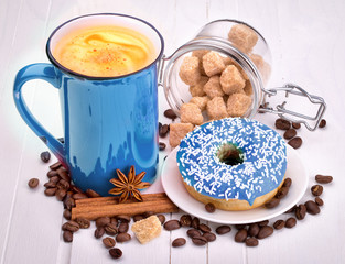 Tasty donut with a cup of coffee