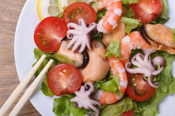 Salad of shrimp, mussels, octopus with vegetables  top view