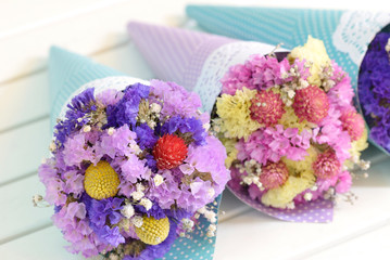 Dried flowers bouquets put into the cones.