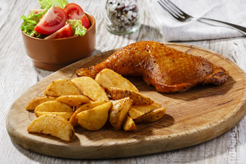chicken leg with baked potatoes