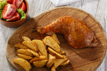 chicken leg with baked potatoes